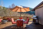 Outdoor patio with a gas fire pit will make you feel like you are in a summer camp.